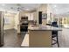 Kitchen with granite counters, stainless appliances, breakfast bar, and open layout at 3865 N Cranberry Blvd, North Port, FL 34286