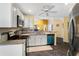 Updated kitchen with white cabinetry, granite countertops, stainless steel appliances, and tile backsplash at 3865 N Cranberry Blvd, North Port, FL 34286