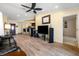 Spacious living room featuring wood-look floors, open floor plan and plenty of room for entertaining at 3865 N Cranberry Blvd, North Port, FL 34286