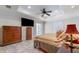 Cozy main bedroom with a tray ceiling, closet and sliding glass door offering plenty of light at 3865 N Cranberry Blvd, North Port, FL 34286