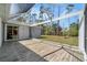 Spacious screened patio with tile flooring, offering a view of the backyard and surrounding landscape at 3865 N Cranberry Blvd, North Port, FL 34286