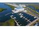 Beautiful aerial view of a marina with many boats and buildings near a body of water at 388 Aruba Cir # 201, Bradenton, FL 34209