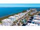 Stunning aerial view of a coastal community with multiple condo buildings, a pool, and easy access to the ocean at 388 Aruba Cir # 201, Bradenton, FL 34209