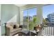 Charming screened-in balcony with comfortable seating and lovely views of the surrounding community at 388 Aruba Cir # 201, Bradenton, FL 34209