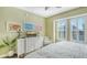 Inviting bedroom featuring natural light, coastal artwork, and a comfortable bed at 388 Aruba Cir # 201, Bradenton, FL 34209