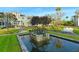 The community features manicured landscaping, mature trees, and water features throughout the neighborhood at 388 Aruba Cir # 201, Bradenton, FL 34209