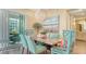 Dining area with stylish chairs and lighting, offering a delightful space for meals and gatherings at 388 Aruba Cir # 201, Bradenton, FL 34209
