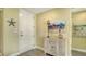 Bright entryway featuring stylish decor, beach-themed accents, and a welcoming atmosphere at 388 Aruba Cir # 201, Bradenton, FL 34209