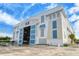 Exterior of a large building with an open facade showcasing stacked boat storage, under a bright sky with light clouds at 388 Aruba Cir # 201, Bradenton, FL 34209