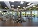 Spacious fitness center with modern equipment, natural light, and beautiful waterfront views at 388 Aruba Cir # 201, Bradenton, FL 34209