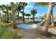 Enjoy the coastal weather in a hammock, with lake views and a sandy seating area at 388 Aruba Cir # 201, Bradenton, FL 34209