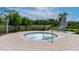 Relaxing hot tub area surrounded by lush greenery and a serene outdoor setting at 388 Aruba Cir # 201, Bradenton, FL 34209