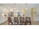 Stylish kitchen boasts white cabinets, stainless steel appliances, and counter seating for casual dining and entertaining at 388 Aruba Cir # 201, Bradenton, FL 34209