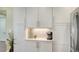 Modern kitchen showcasing sleek white cabinets and stainless steel appliances, perfect for cooking and storage at 388 Aruba Cir # 201, Bradenton, FL 34209