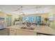Spacious kitchen island with a sink seamlessly connects the cooking and living areas for easy entertaining at 388 Aruba Cir # 201, Bradenton, FL 34209