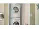 Convenient laundry area with stacked washer and dryer, located next to the kitchen at 388 Aruba Cir # 201, Bradenton, FL 34209