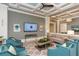 Inviting living room featuring comfortable seating, coffered ceilings, and a modern entertainment center at 388 Aruba Cir # 201, Bradenton, FL 34209