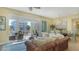 Inviting living room featuring comfortable seating, a dining area, and a balcony with scenic views at 388 Aruba Cir # 201, Bradenton, FL 34209
