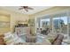 Cozy living room showcasing a comfortable sofa, stylish decor, and a balcony with beautiful neighborhood views at 388 Aruba Cir # 201, Bradenton, FL 34209