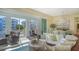 Inviting living room featuring comfortable seating, a dining area, and a balcony with scenic views at 388 Aruba Cir # 201, Bradenton, FL 34209