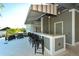 An outdoor bar area provides lounge seating and a bar top with views of the surrounding area at 388 Aruba Cir # 201, Bradenton, FL 34209