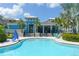 Inviting community pool and cabana offer a refreshing escape with comfortable seating and lush greenery at 388 Aruba Cir # 201, Bradenton, FL 34209