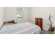 Bedroom boasts a cozy bed, natural lighting, and laminate flooring at 3926 Sunshine Pine Ave, Bradenton, FL 34203
