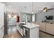 Modern kitchen island features a stainless steel sink and stylish pendant lighting at 3926 Sunshine Pine Ave, Bradenton, FL 34203