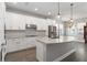 Modern kitchen with stainless appliances, gorgeous countertops and center island at 3926 Sunshine Pine Ave, Bradenton, FL 34203