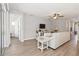 Bright living room with hardwood floors, ceiling fan and open concept design at 3926 Sunshine Pine Ave, Bradenton, FL 34203