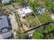 Aerial view of the home surrounded by lush landscaping, with a spacious yard at 401 27Th W St, Bradenton, FL 34205