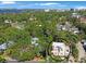Aerial shot highlighting the home's location amidst lush greenery and proximity to the water at 401 27Th W St, Bradenton, FL 34205
