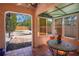 View of the gravel backyard and patio from the enclosed porch at 401 27Th W St, Bradenton, FL 34205
