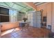 Enclosed tiled porch with outdoor furniture and a view of the backyard at 401 27Th W St, Bradenton, FL 34205