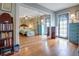 Inviting bedroom featuring built-in shelves, ample natural light, and wood floors at 401 27Th W St, Bradenton, FL 34205