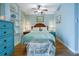 Bright bedroom with vintage furnishings, wood floors, and natural light at 401 27Th W St, Bradenton, FL 34205