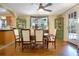 Cozy dining room featuring hardwood floors, vintage furnishings, and natural light at 401 27Th W St, Bradenton, FL 34205
