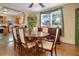 A formal dining room showcases hardwood floors and an attractive wooden table with chairs at 401 27Th W St, Bradenton, FL 34205