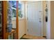 Cozy entryway featuring display cabinet, tile flooring, and a white door at 401 27Th W St, Bradenton, FL 34205