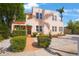 Charming home featuring coral stucco, terra cotta accents, and landscaped front yard at 401 27Th W St, Bradenton, FL 34205