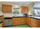 Kitchen with wooden cabinets, tile countertops, and stainless steel appliances at 401 27Th W St, Bradenton, FL 34205