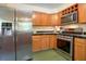 An updated kitchen with stainless steel appliances and wooden cabinetry at 401 27Th W St, Bradenton, FL 34205