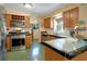 The kitchen features sleek stainless steel appliances, tile countertops and wine rack at 401 27Th W St, Bradenton, FL 34205