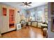 Bright living room with hardwood floors, sauna, and colorful paintings on the walls at 401 27Th W St, Bradenton, FL 34205