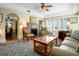 Spacious living room with a fireplace, decorative rugs, and hardwood floors at 401 27Th W St, Bradenton, FL 34205