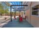 Inviting outdoor space featuring a covered patio with stylish dining set, creating a perfect spot for relaxation and entertainment at 401 27Th W St, Bradenton, FL 34205