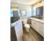 Updated bathroom with a glass-enclosed shower, granite countertops, and modern fixtures at 41 Young Ave, Englewood, FL 34223