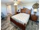 Comfortable bedroom with wood furnishings, a ceiling fan, and a spacious closet at 41 Young Ave, Englewood, FL 34223