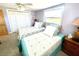 Bright bedroom featuring two twin beds, closet, and a comfortable atmosphere at 41 Young Ave, Englewood, FL 34223