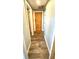 Hallway features wood-look floors and a wooden door at 41 Young Ave, Englewood, FL 34223